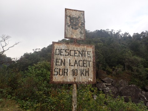 A warning sign near a dangerous part of a trail